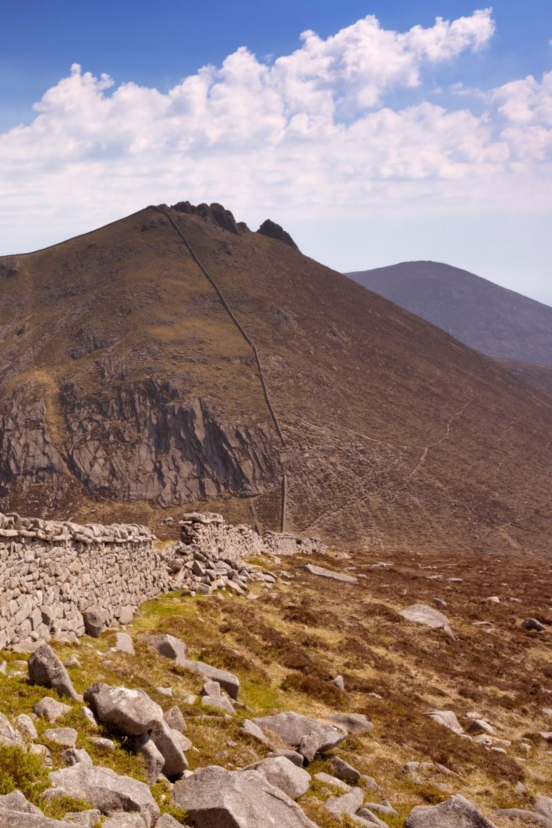 The 15 best walks in Ireland, from breathtaking coastal cliffs to serene mountain trails. Explore stunning landscapes, historic sites and hidden gems perfect for every hiker. Northern Ireland Walks, Nature Walks Ireland, Cliffs Of Moher Coastal Walk, Wicklow Way, Giants Causeway Cliff Walk, Croagh Patrick Pilgrim Path, Carrauntoohil, Howth Cliff Walk, Burren Way, Glendalough Spinc Walk, Slieve League Cliffs Walk, Aran Islands Loop Walk, Gap Of Dunloe Walk, Easy Walks In Ireland, Hiking Ireland